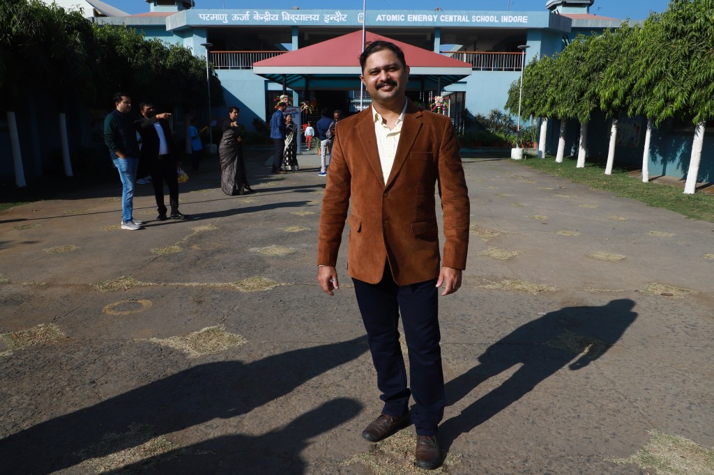 That's me, in front of the Atomic Energy Central School, Indore. This is where we'd assemble for morning prayers.